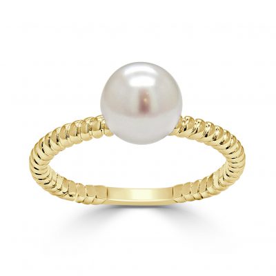 A large akoya pearl mounted on a gold ring.