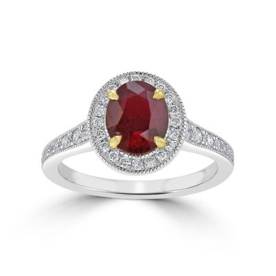 A large halo-set ruby surrounded by smaller diamonds.